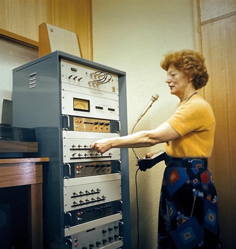 lady with microphone and sound system 1976